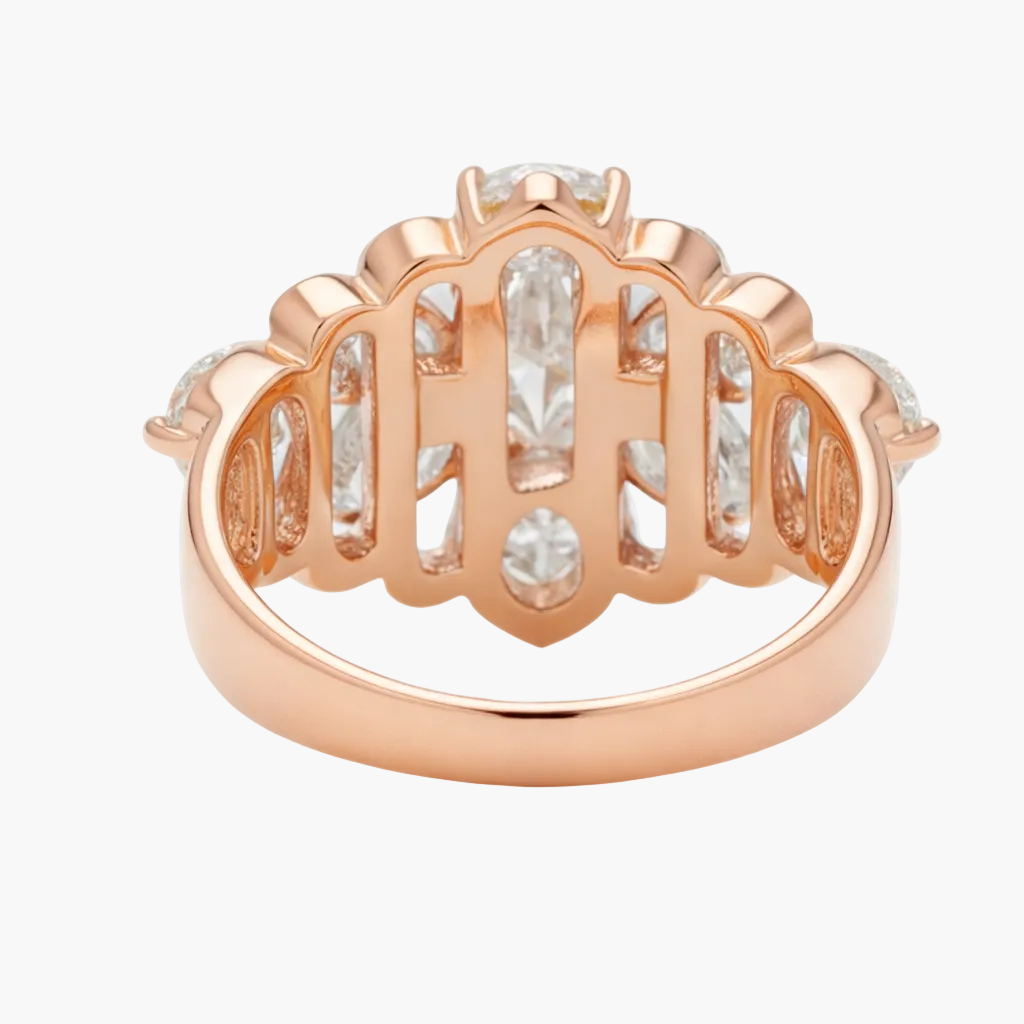 Rose gold ring with diamond accents on a white background