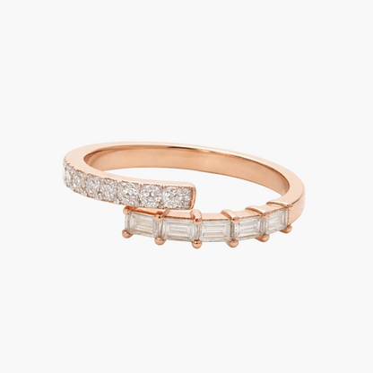 Rose gold ring with diamond accents on a white background