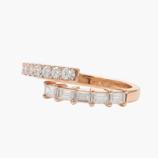 Rose gold ring with diamond accents on a white background