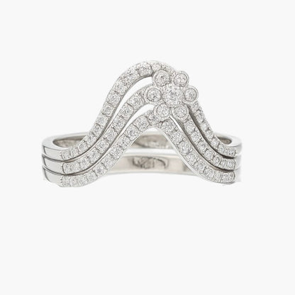 Silver ring with diamond accents on a white background