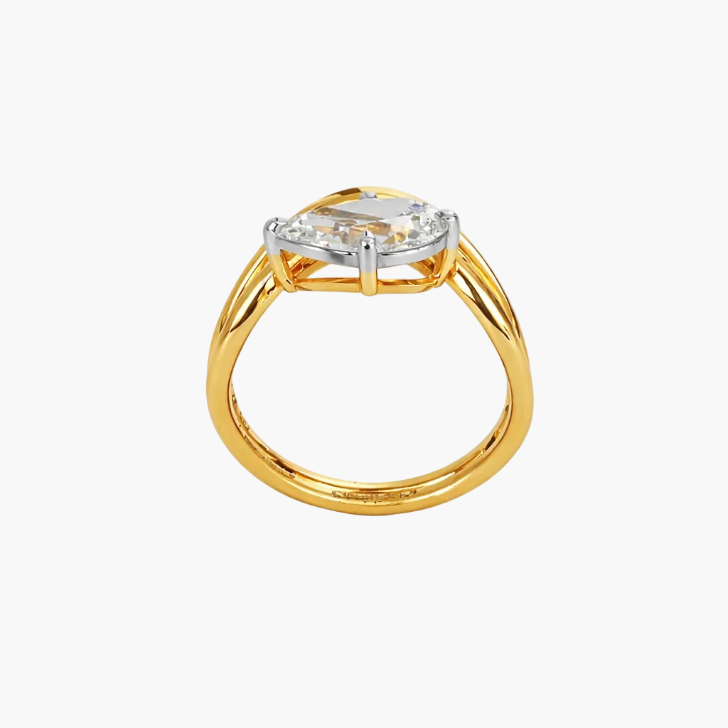 Gold ring with a diamond on a white background