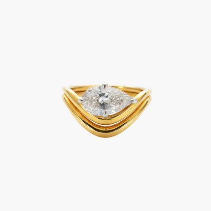Gold ring with a diamond on a white background