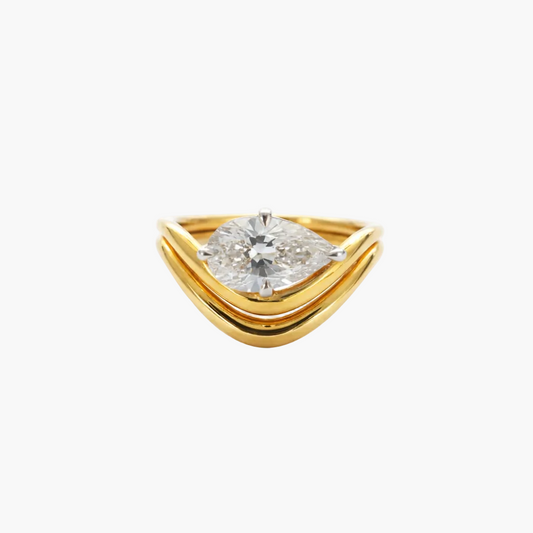 Gold ring with a diamond on a white background
