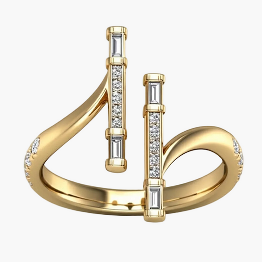 Gold ring with diamond accents on a white background