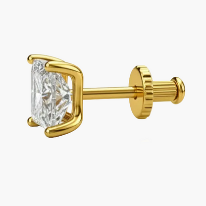 Gold earring with a clear gemstone on a white background
