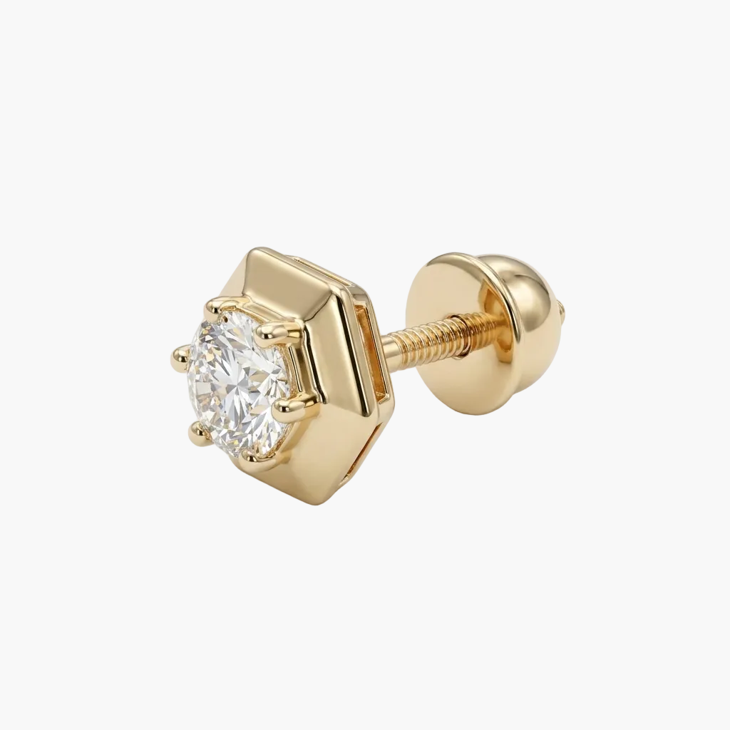 Gold stud earring with a clear gemstone on a white background
