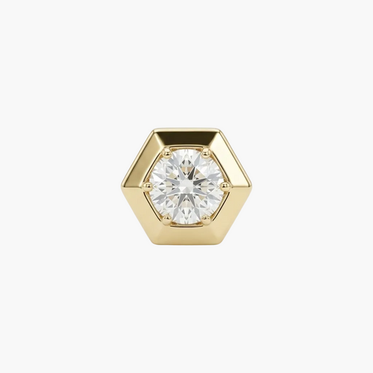 Gold hexagonal diamond earring on a light gray background