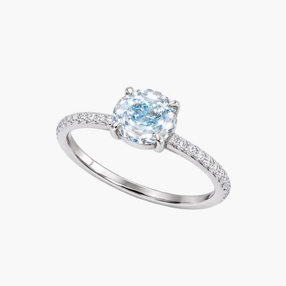 Silver ring with a blue gemstone on a white background