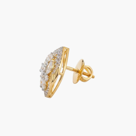 Gold earring with clear gemstones on a light gray background