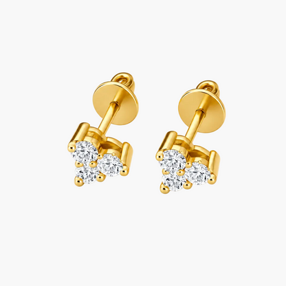 A pair of gold stud earrings with a small cluster of clear round-cut gemstones, shown on a clean white background.