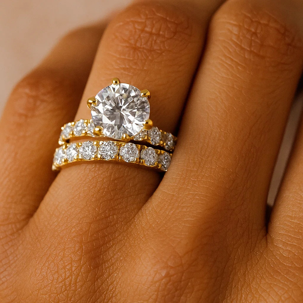 Gold diamond ring on a person's finger