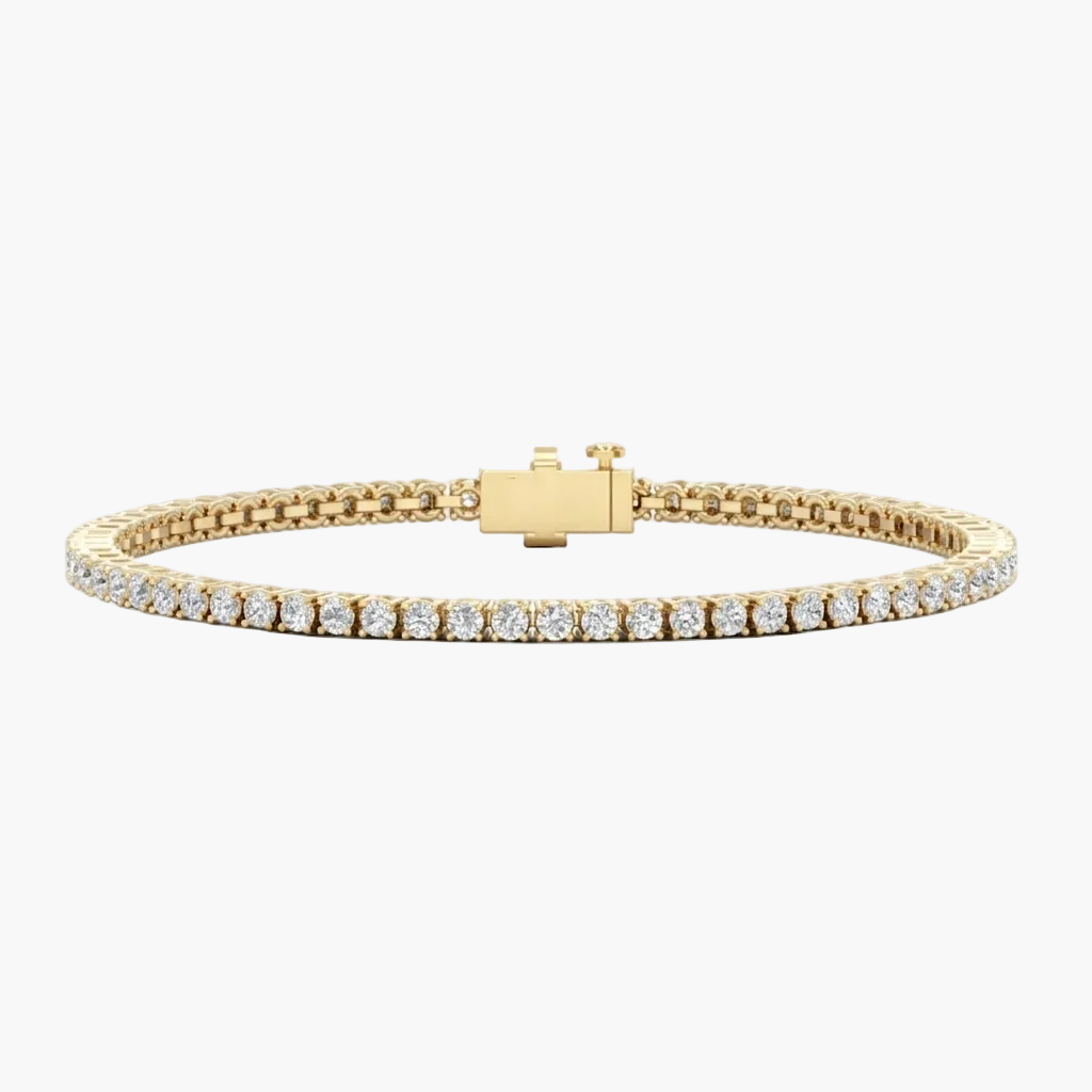 Gold bracelet with diamond accents on a white background