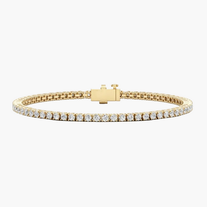 Gold bracelet with diamond accents on a white background