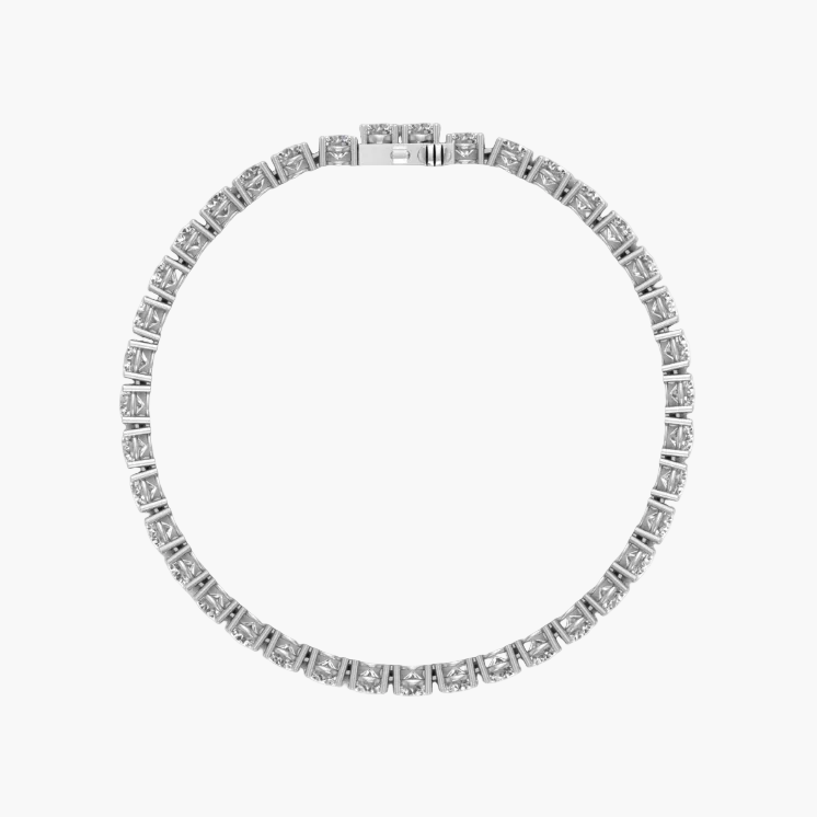 Silver bracelet with clear stones on a white background