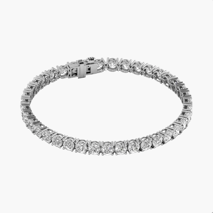 Silver bracelet with clear gemstones on a white background