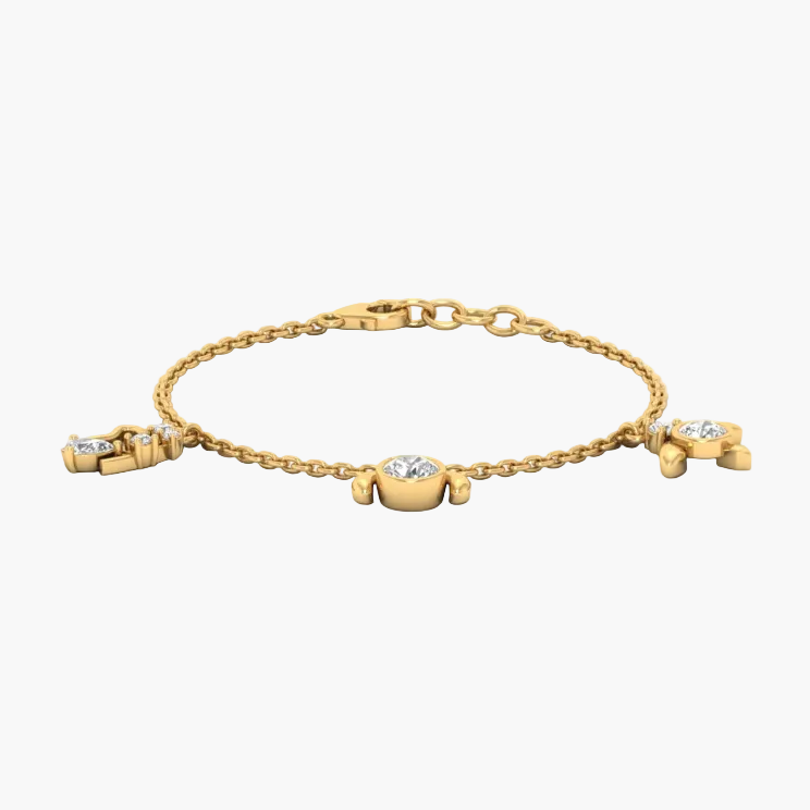 Gold bracelet with diamond accents on a white background