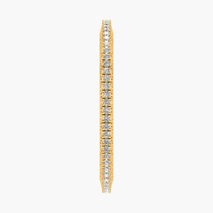 Gold earring with embedded diamonds on a white background