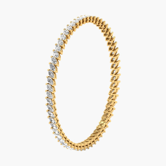 Gold bracelet with diamond accents on a white background