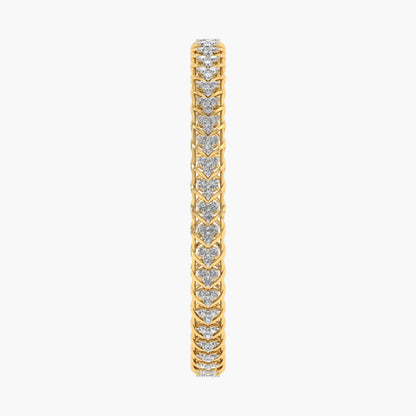 Gold bracelet with heart-shaped diamond stones on a white background