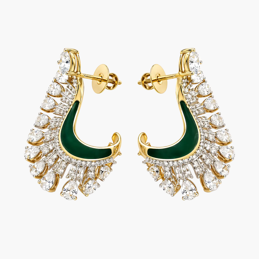 Gold earrings with green enameled crescent design on a white background