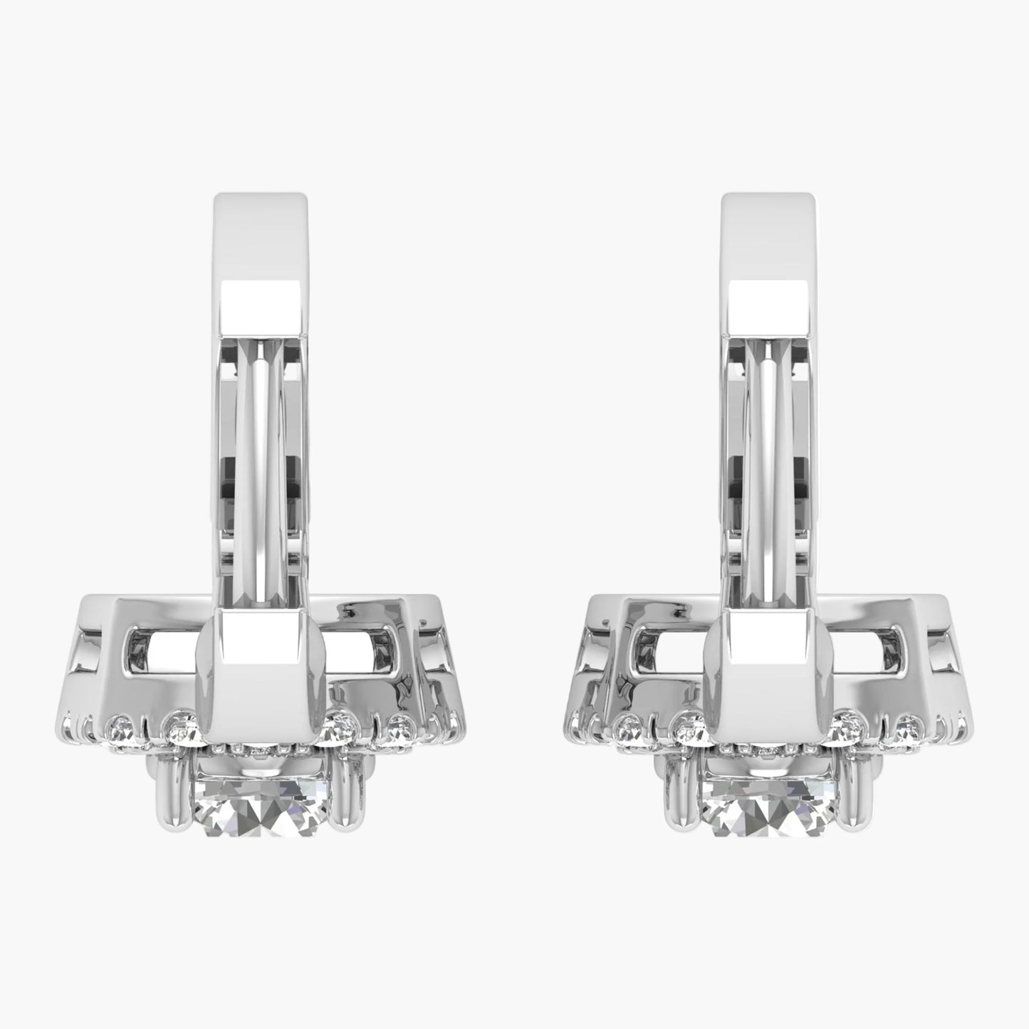 Pair of silver earrings with clear gemstones on a white background