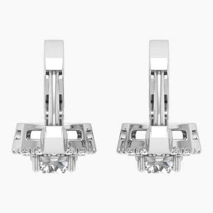 Pair of silver earrings with clear gemstones on a white background