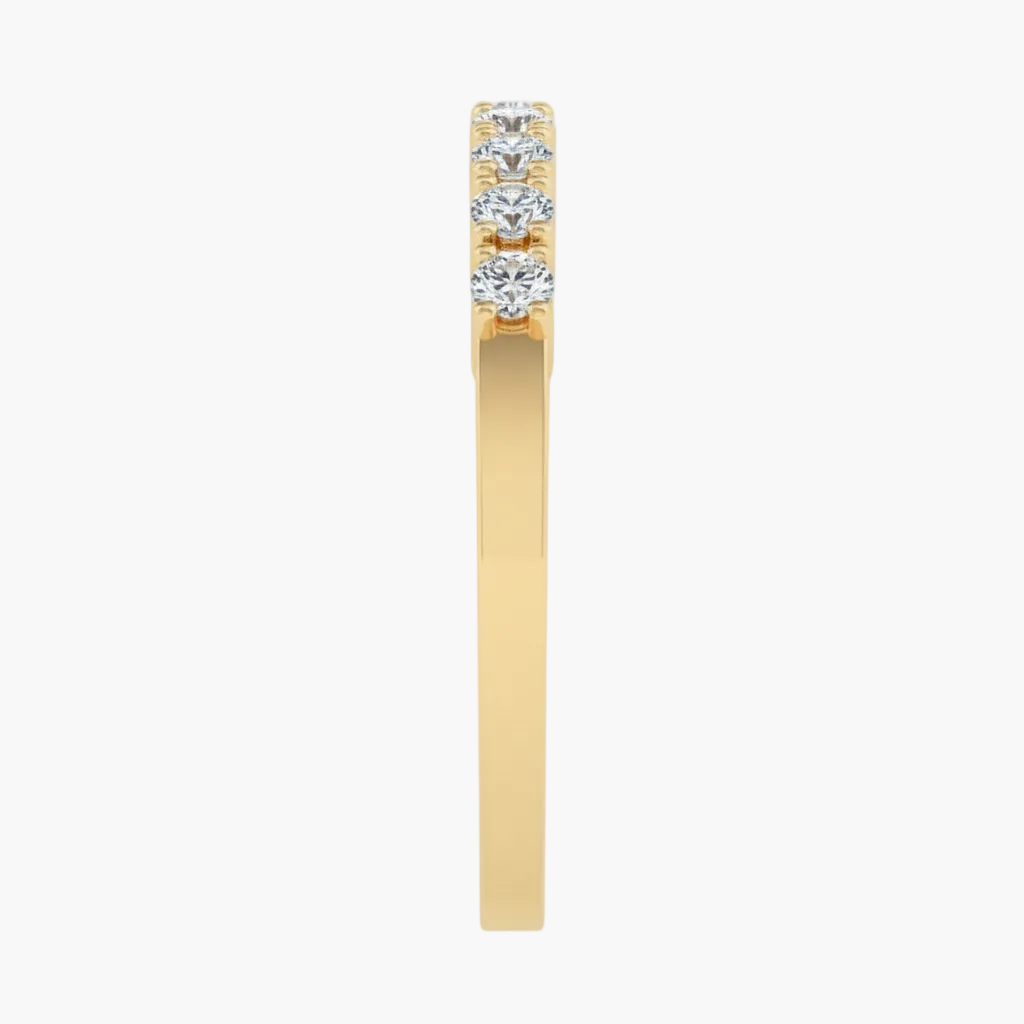 Gold ring with three diamonds on a white background