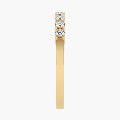 Gold ring with three diamonds on a white background