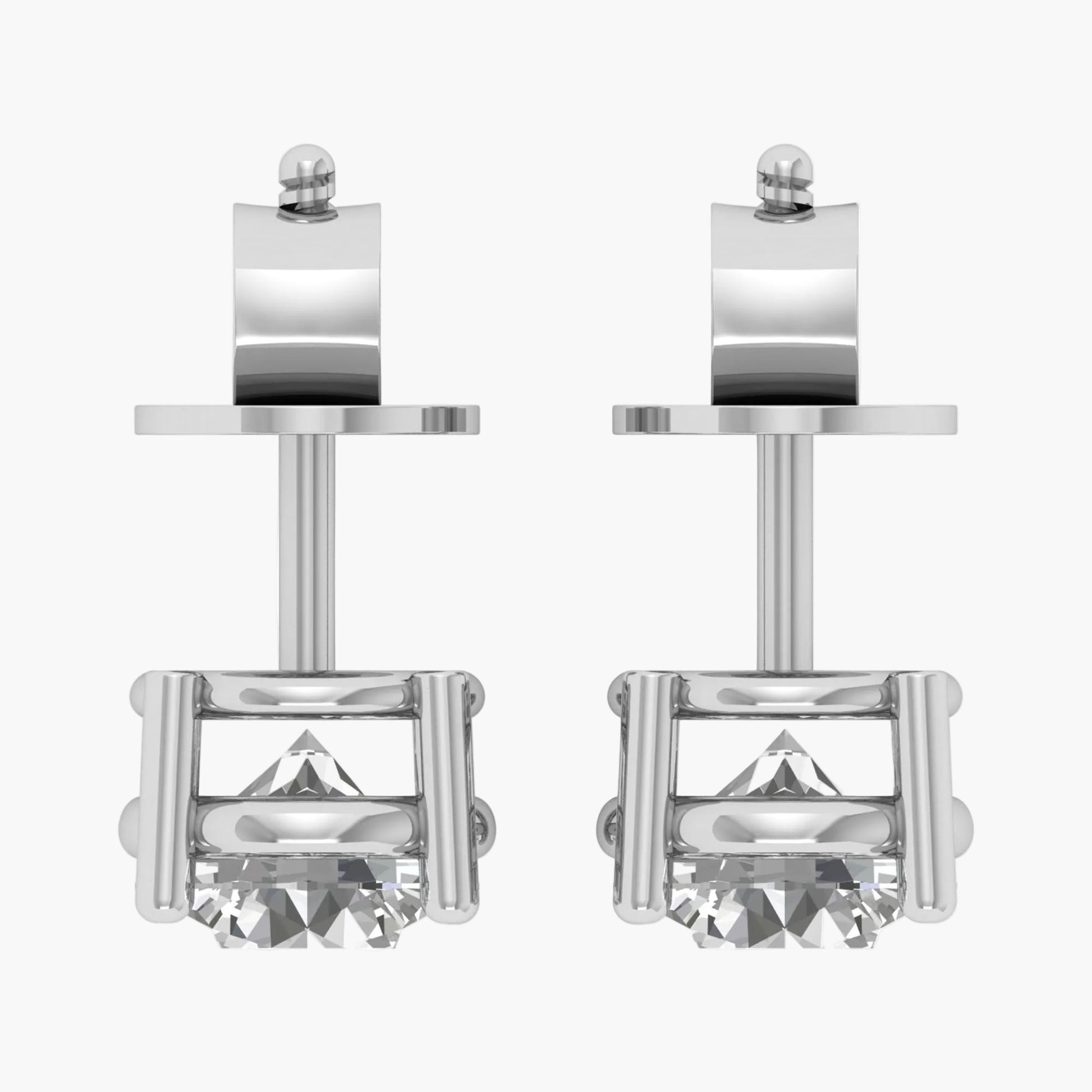 Pair of silver stud earrings with a clear gemstone on a white background