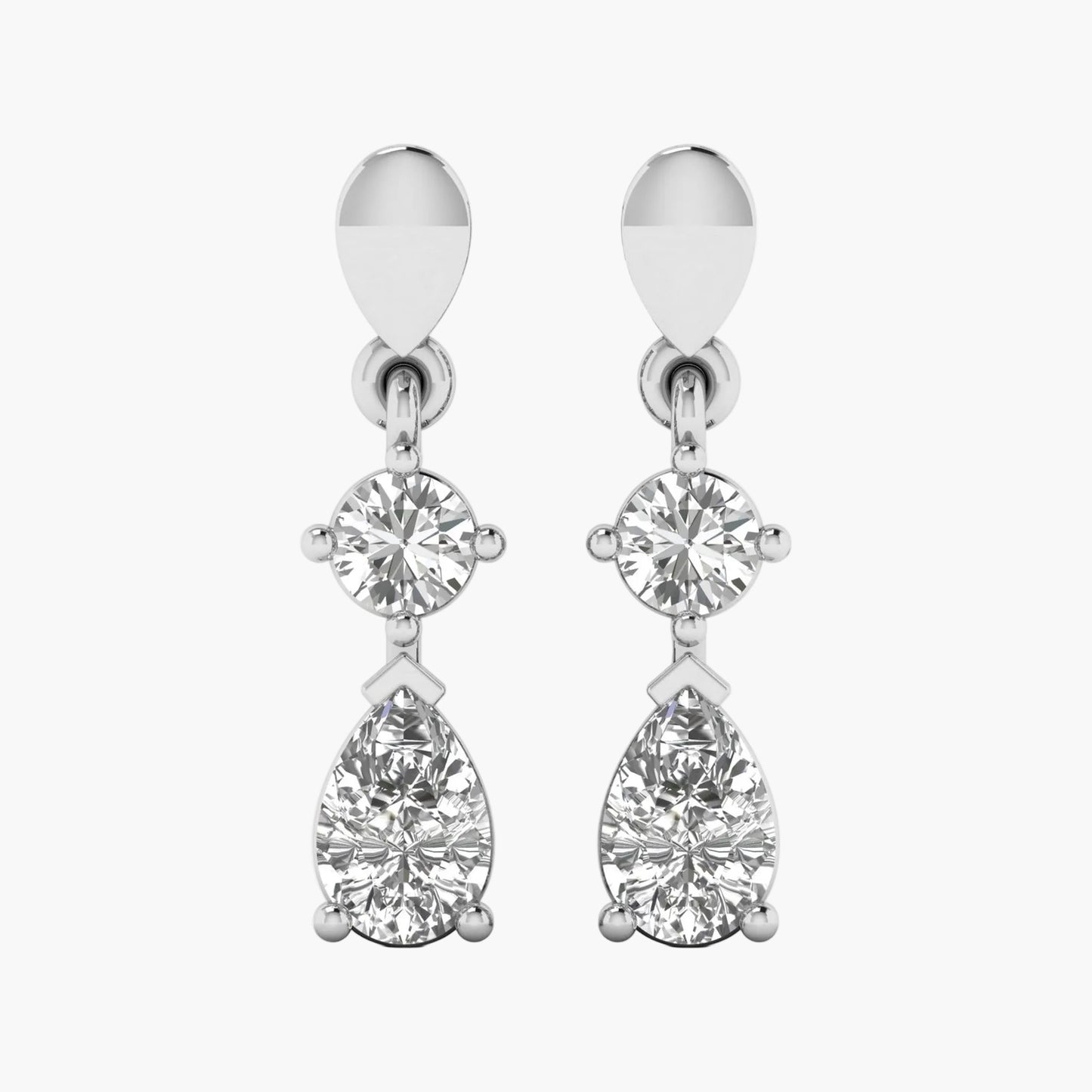 Pair of silver earrings with clear gemstones on a white background