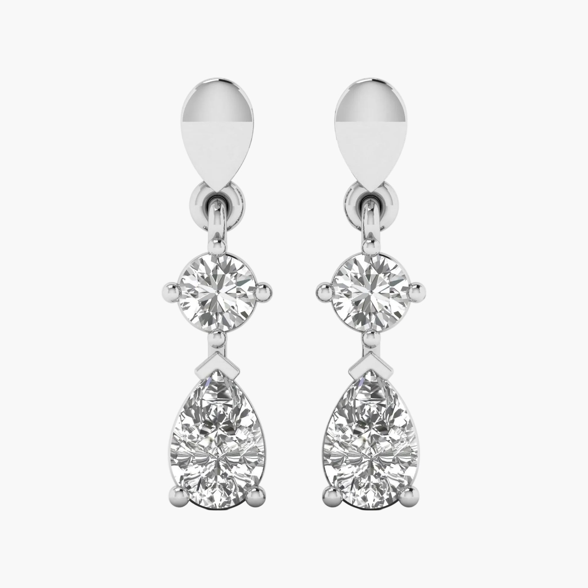 Pair of silver earrings with clear gemstones on a white background