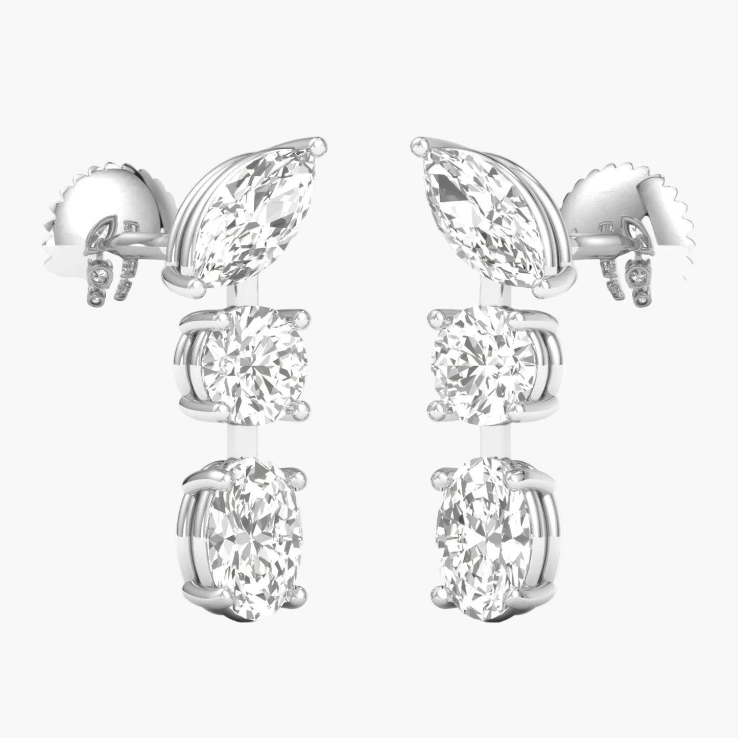 Pair of silver earrings with clear gemstones on a white background