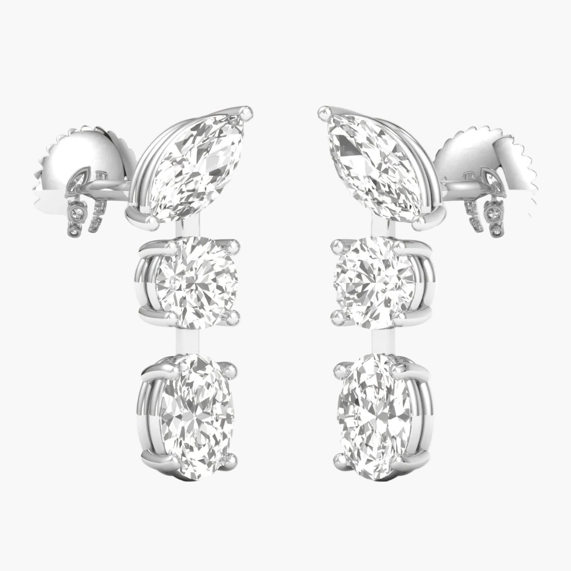 Pair of silver earrings with clear gemstones on a white background