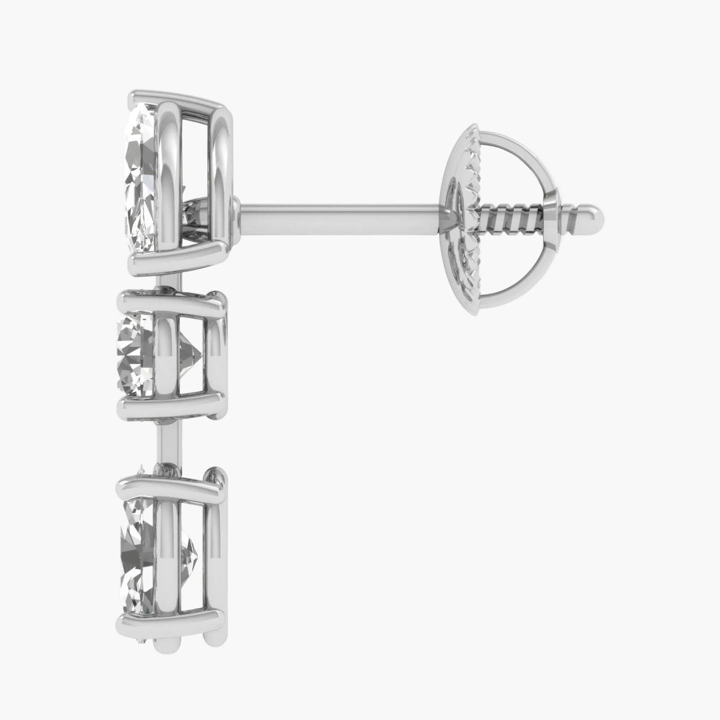 Silver earring with intricate design on a white background