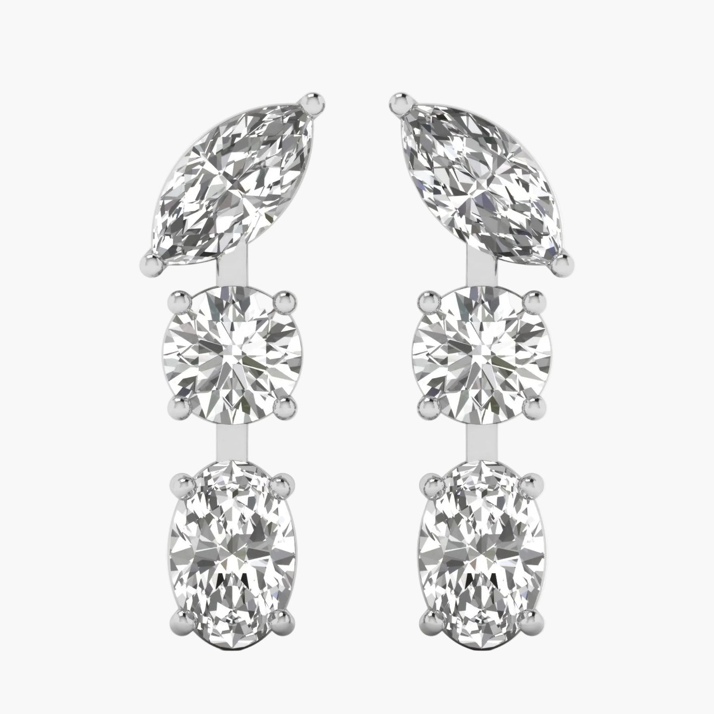 Pair of silver earrings with clear gemstones on a white background
