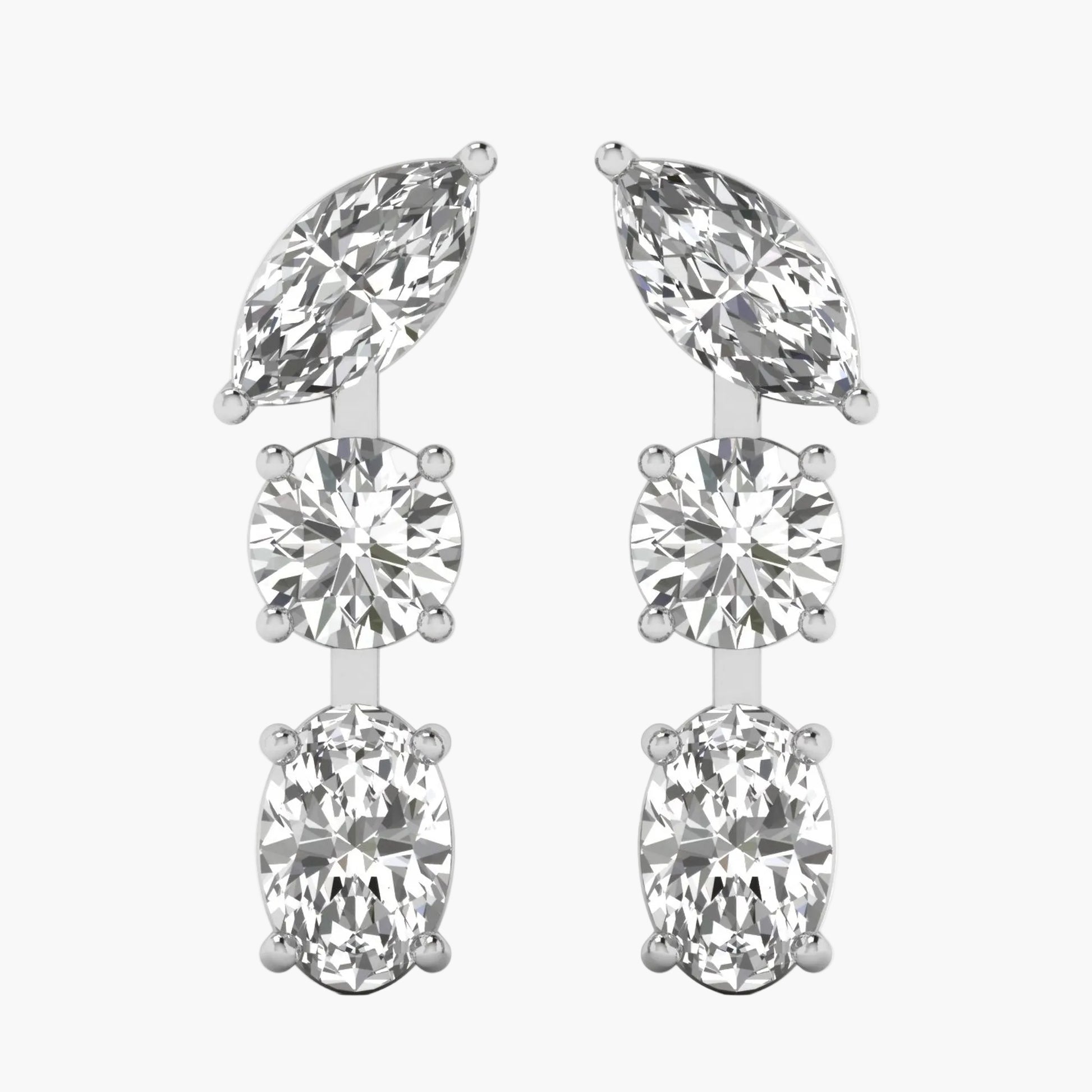 Pair of silver earrings with clear gemstones on a white background