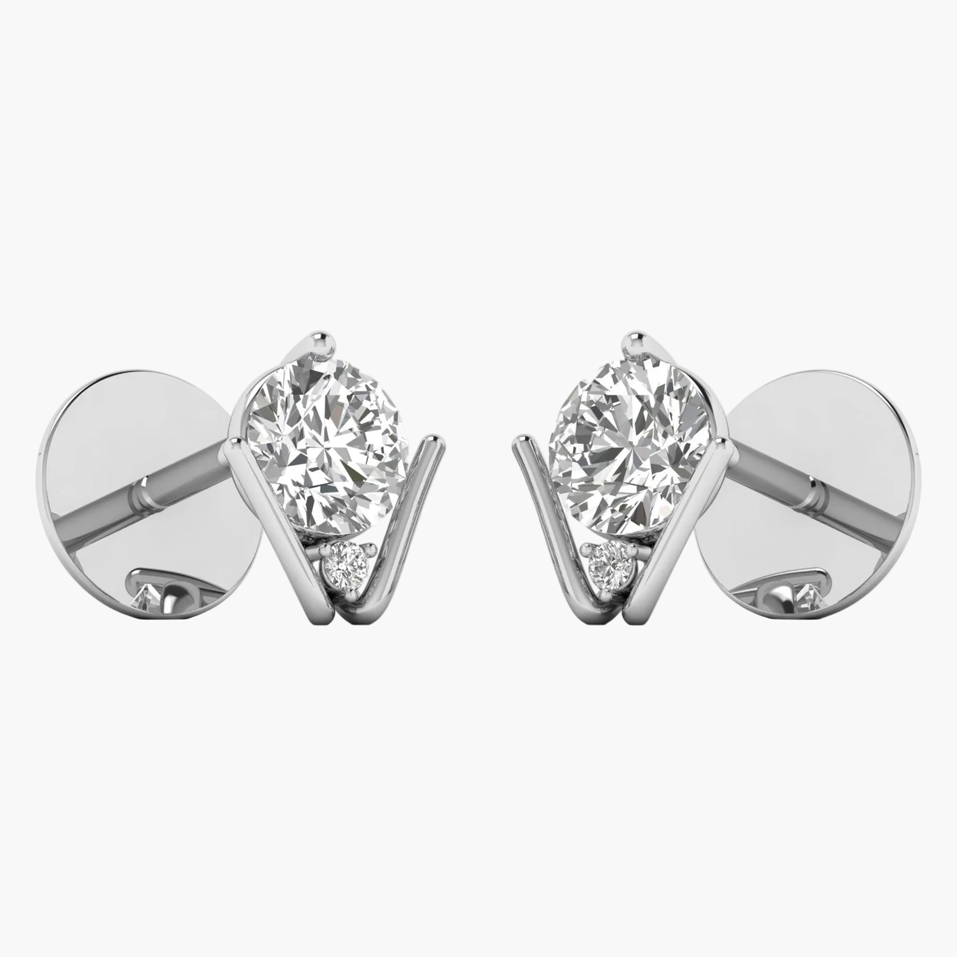 Pair of diamond stud earrings on a white background