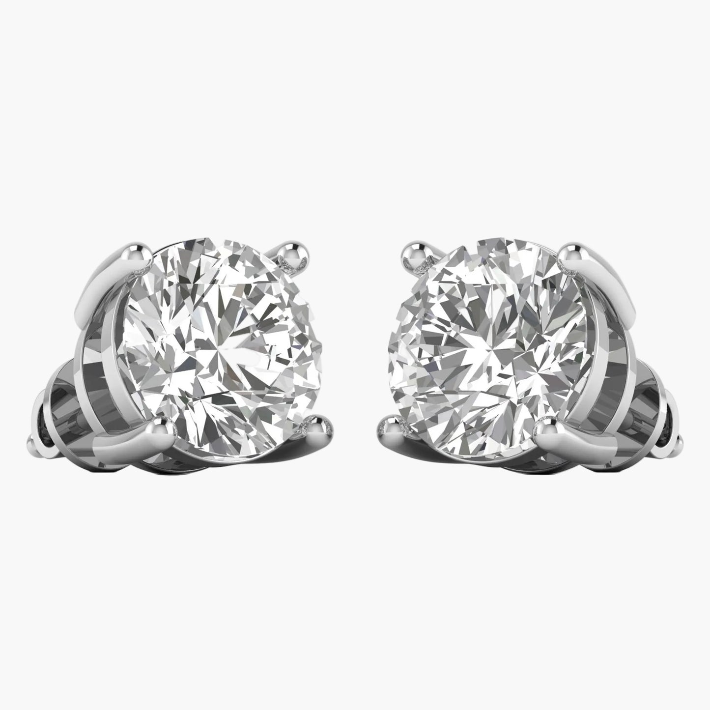 Pair of diamond stud earrings on a white background