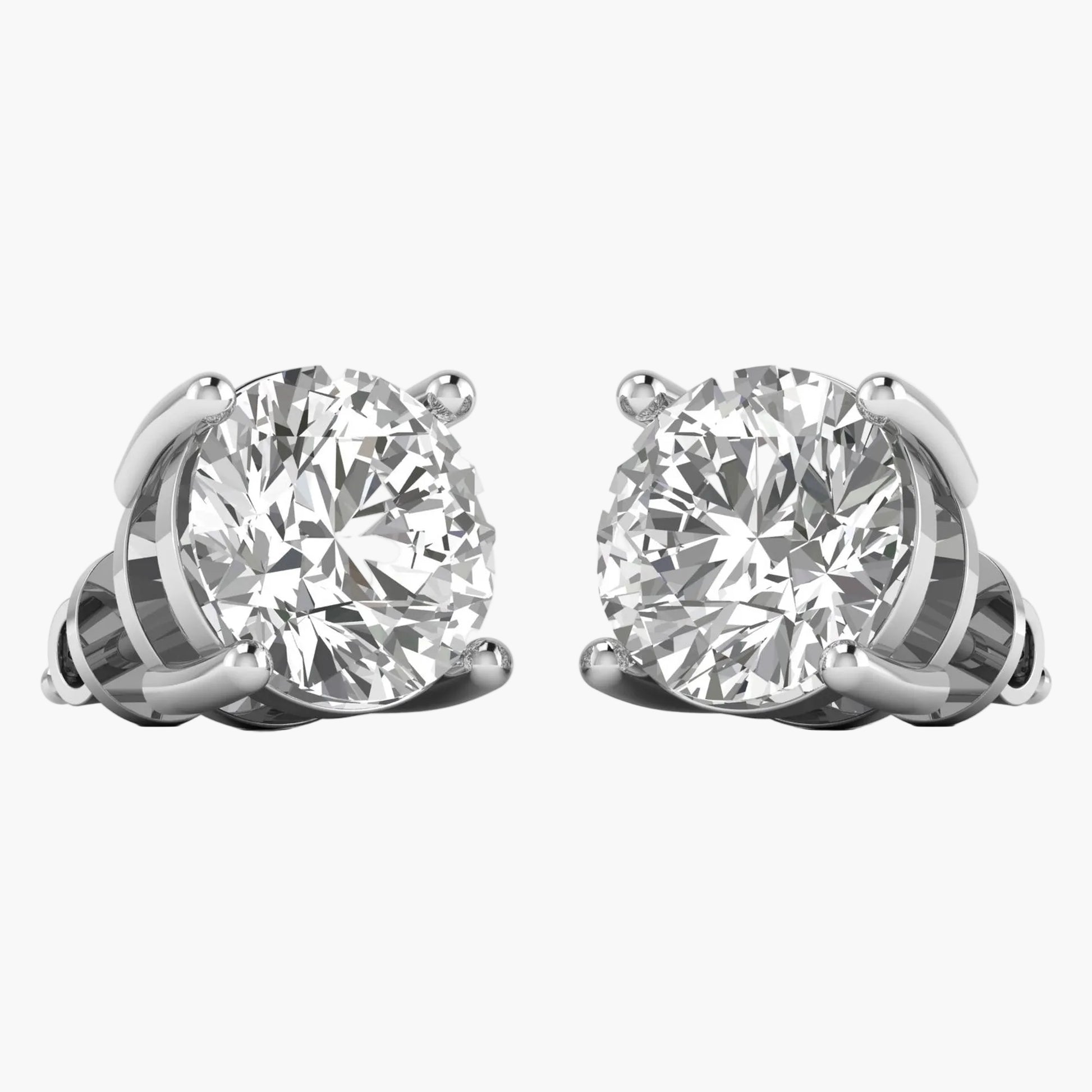 Pair of diamond stud earrings on a white background