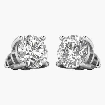 Pair of diamond stud earrings on a white background