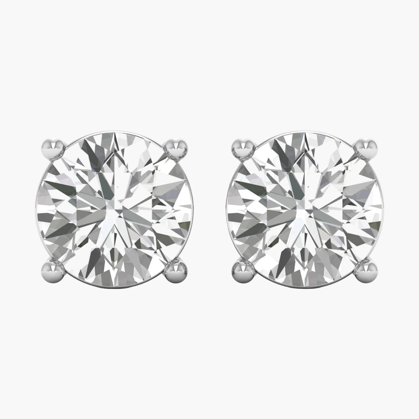 Pair of diamond stud earrings on a white background