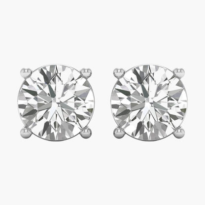 Pair of diamond stud earrings on a white background