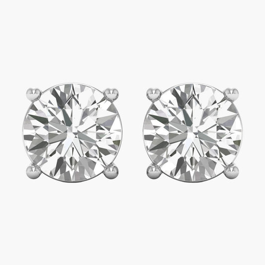 Pair of diamond stud earrings on a white background