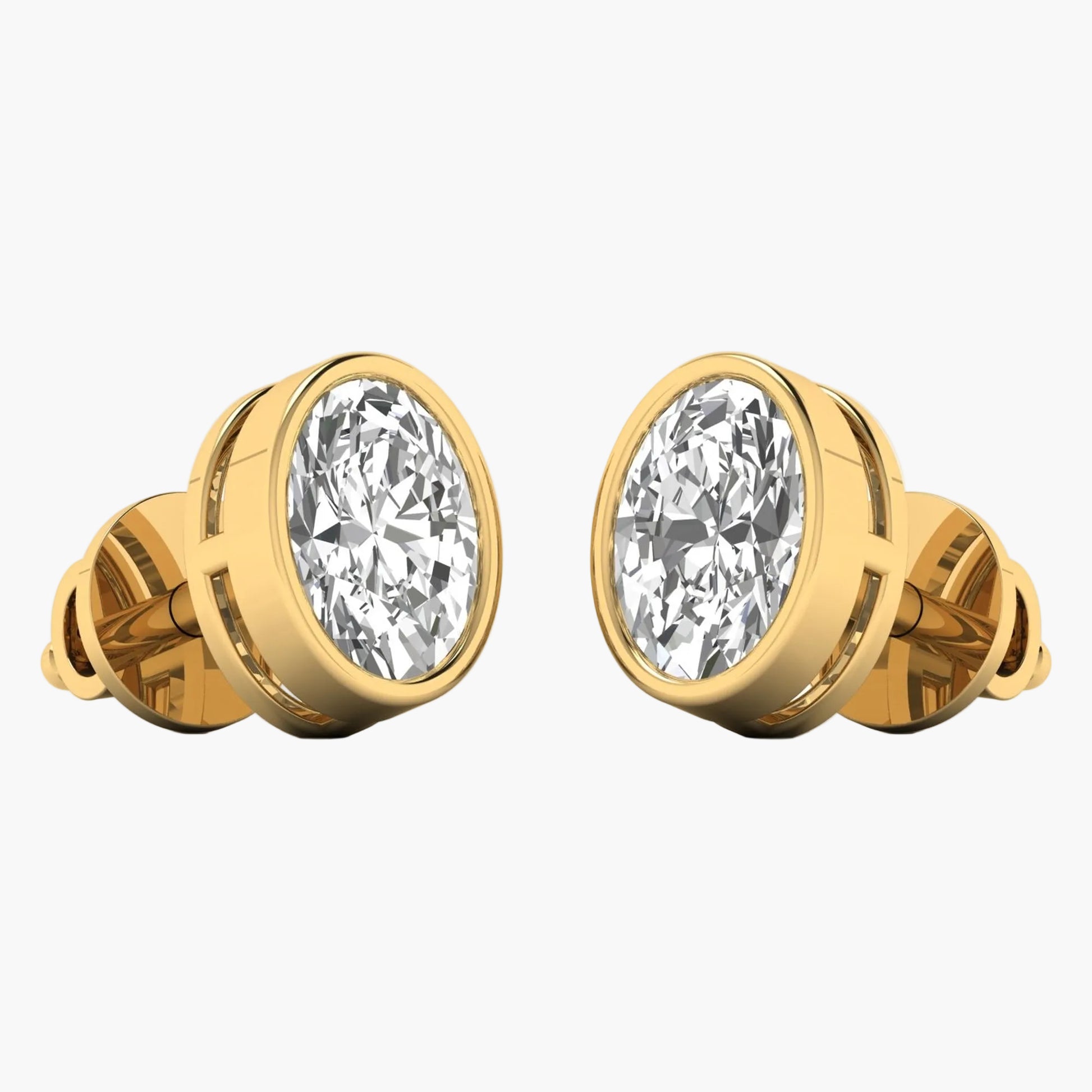 Gold earrings with large clear gemstones on a white background
