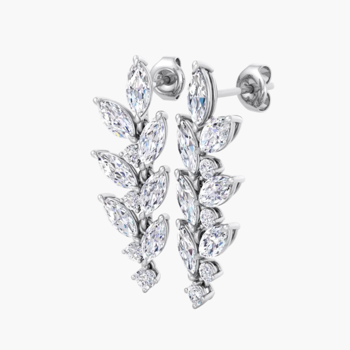 Pair of silver earrings with clear gemstones on a white background
