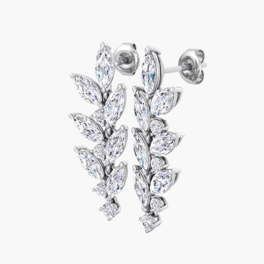 Pair of silver earrings with clear gemstones on a white background