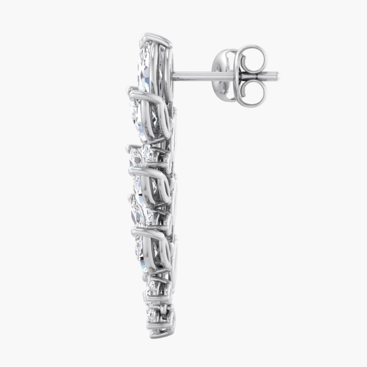 Silver earring with clear gemstones on a white background