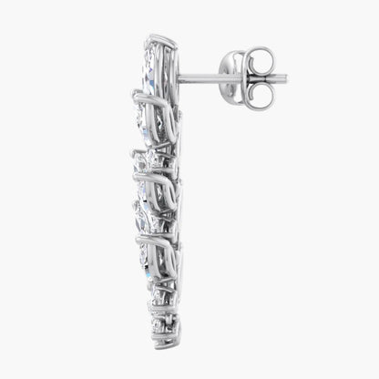 Silver earring with clear gemstones on a white background