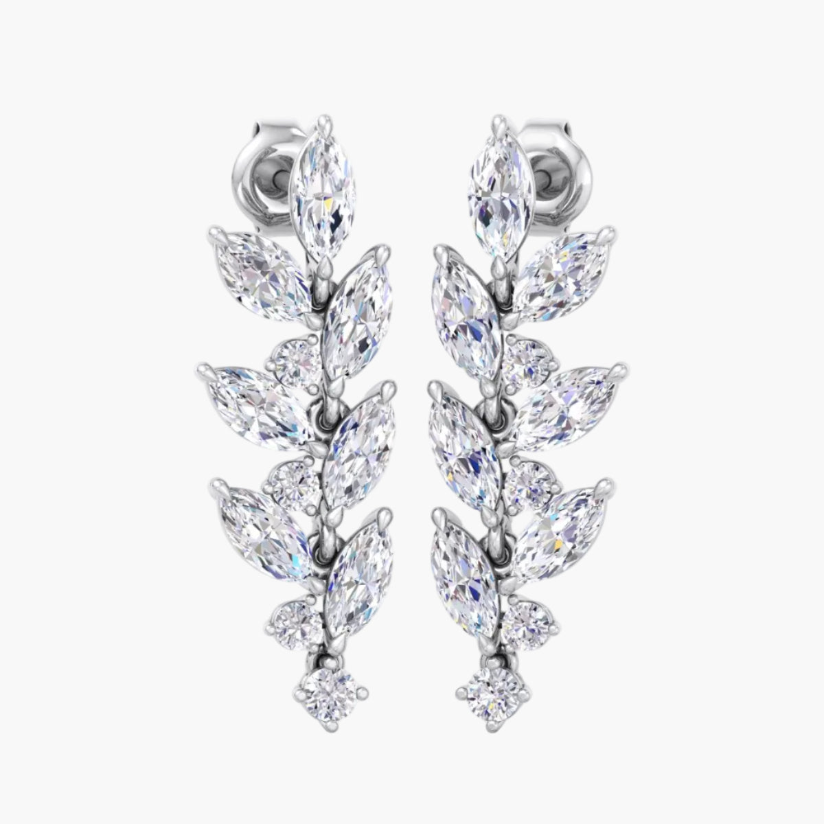 Pair of silver earrings with clear gemstones on a white background