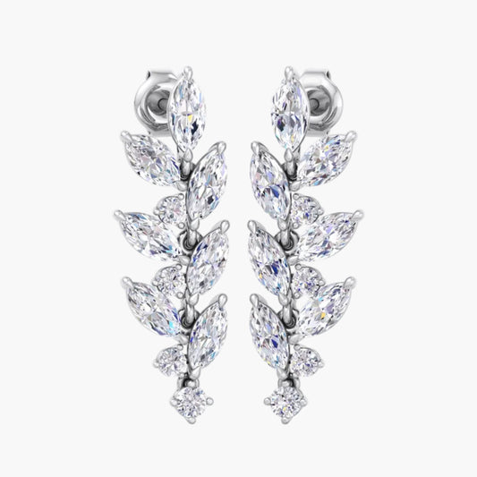 Pair of silver earrings with clear gemstones on a white background